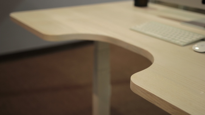The curved cutout allows for arm rests whether you're sitting or standing