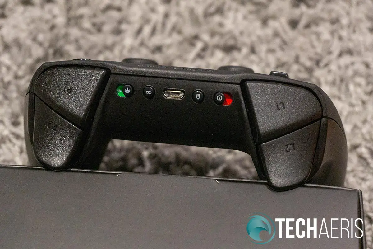 The switches, buttons, and ports on the back of the SteelSeries Stratus Duo game controller