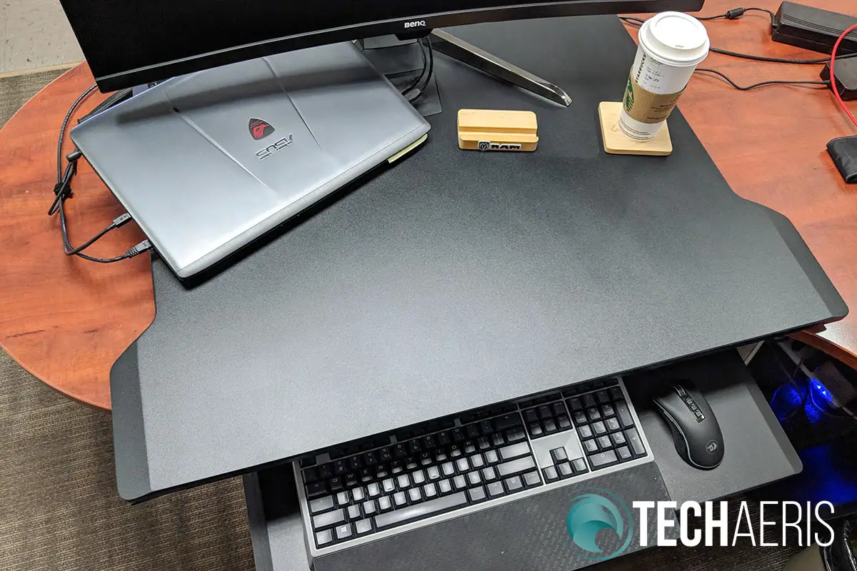 The Ergotron WorkFit-TX standing desk converter with laptop and 35" monitor
