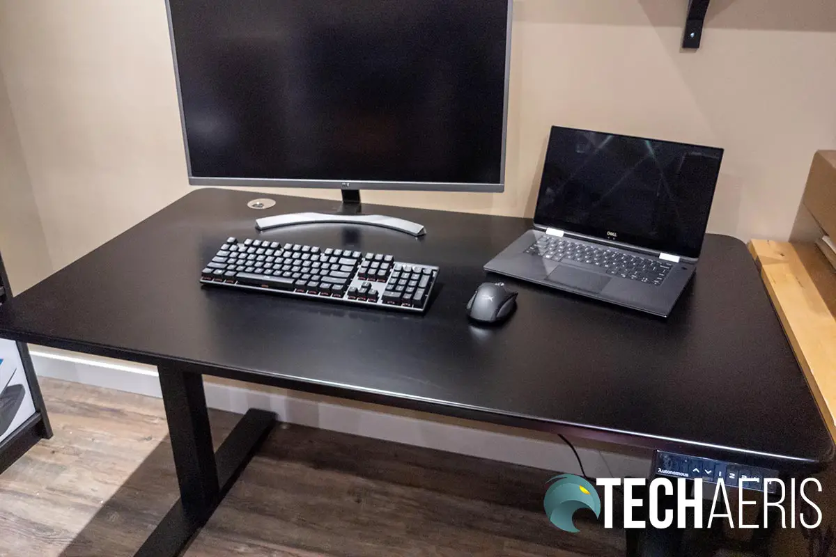 The assembled SmartDesk 2 Home Office with monitor, laptop, and peripherals