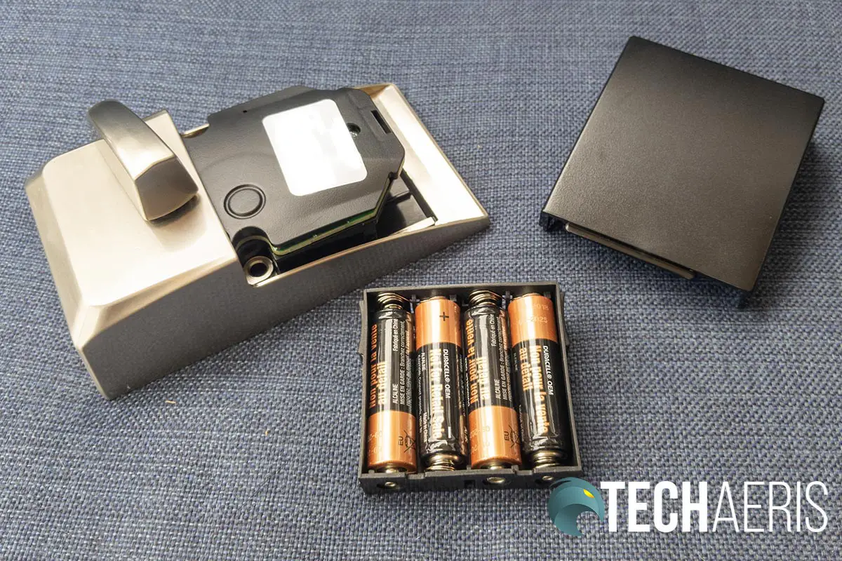 The battery pack and cover from the Schlage Encode Smart Wi-Fi Deadbolt