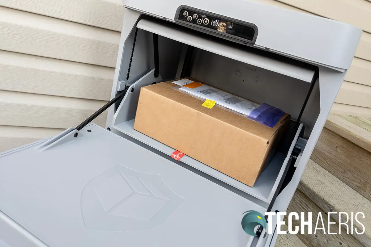 The Danby Parcel Guard Smart Mailbox with a package for delivery