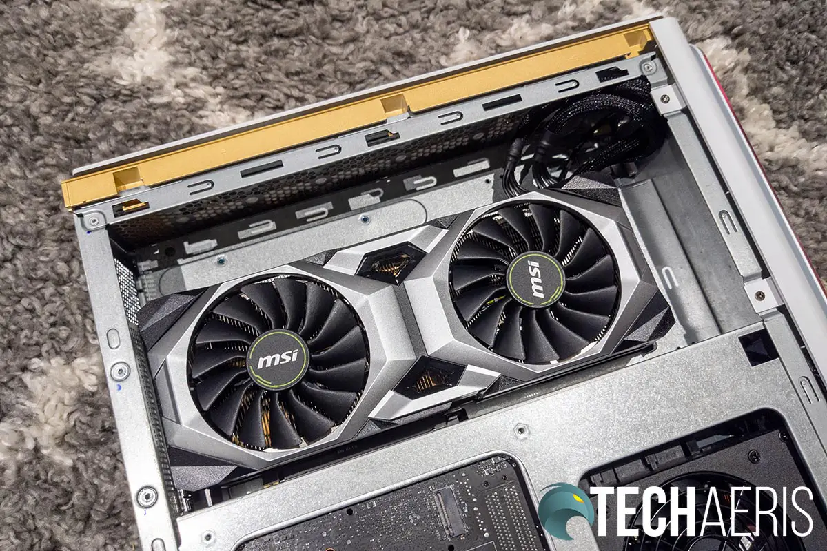 The left side of the the MSI P100 Prestige 8929 desktop computer with the panel removed showing the MSI GeForce RTX™ 2080 Ti 11GB GDDR6 graphics card