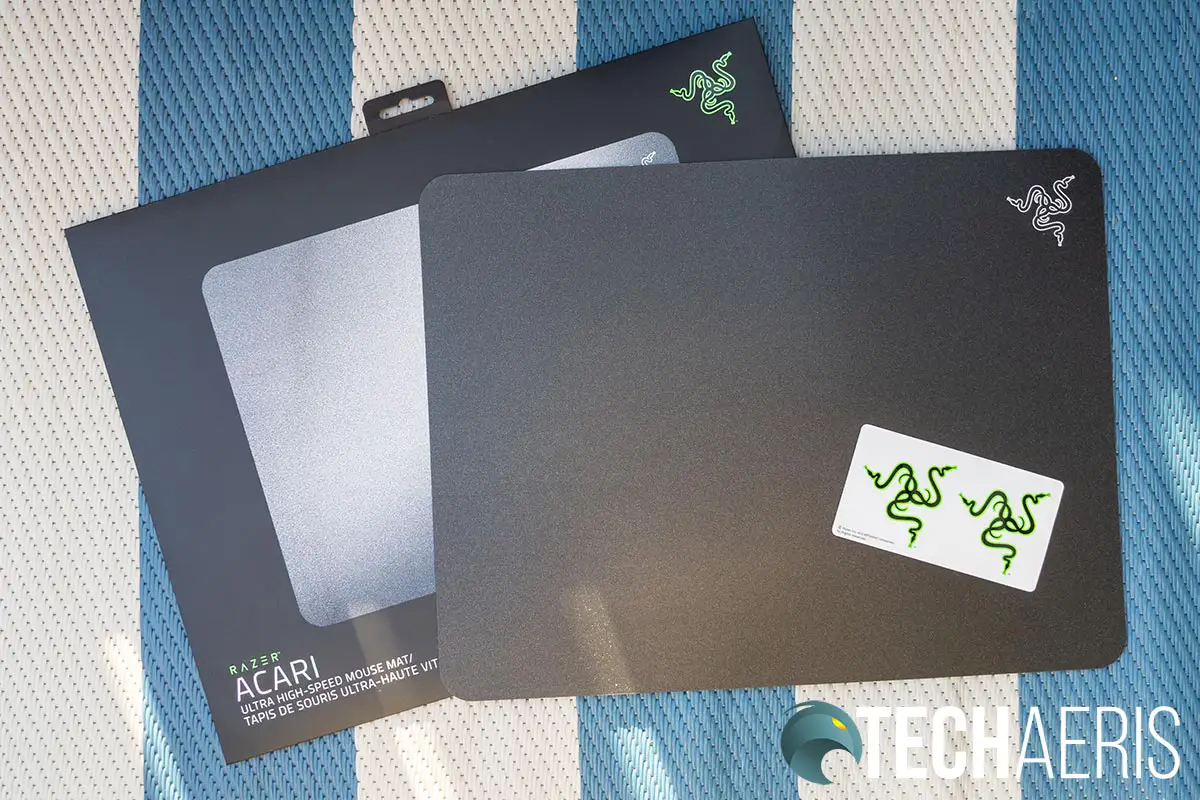 The Razer Acari mouse mat with Razer stickers and packaging
