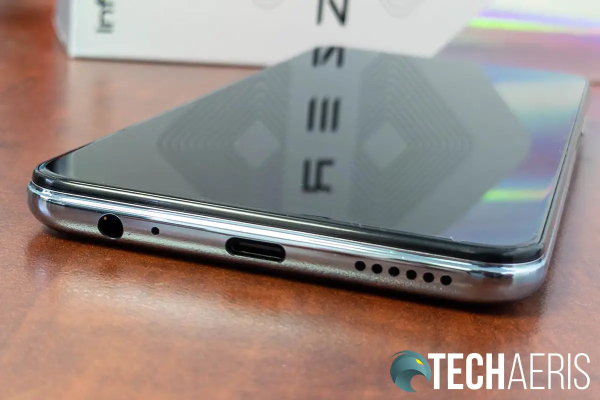 The 3.5mm audio jack, USB Type-C charging/data port, and single speaker on the bottom of the Infinix ZERO 8 Android smartphone
