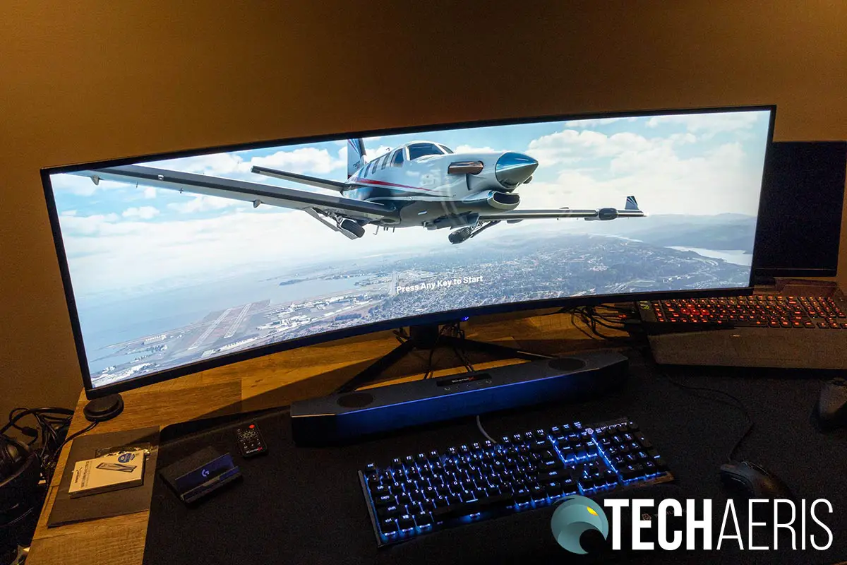 The Monoprice Dark Matter 40865 49-inch DQHD Curved Gaming Monitor with Microsoft Flight Simulator shown on screen