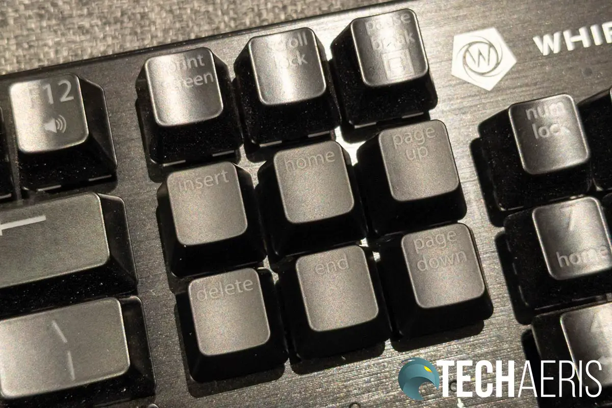 The default (glossy) keycaps versus the newer matte keycaps on the Whirlwind FX Element mechanical gaming keyboard