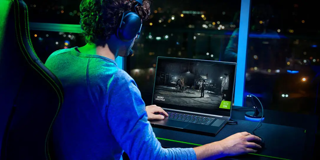 Razer Blade Pro 17 gaming laptop with gamer playing Call of Duty