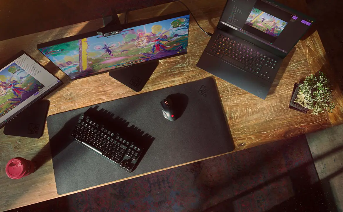 HP OMEN gaming laptops with monitors on desk