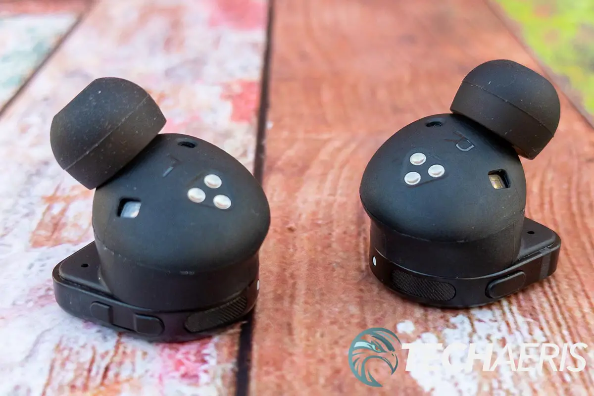 The left earbud has volume controls while the right has a single multi-function button on the Master & Dynamic MW08 true wireless earbuds