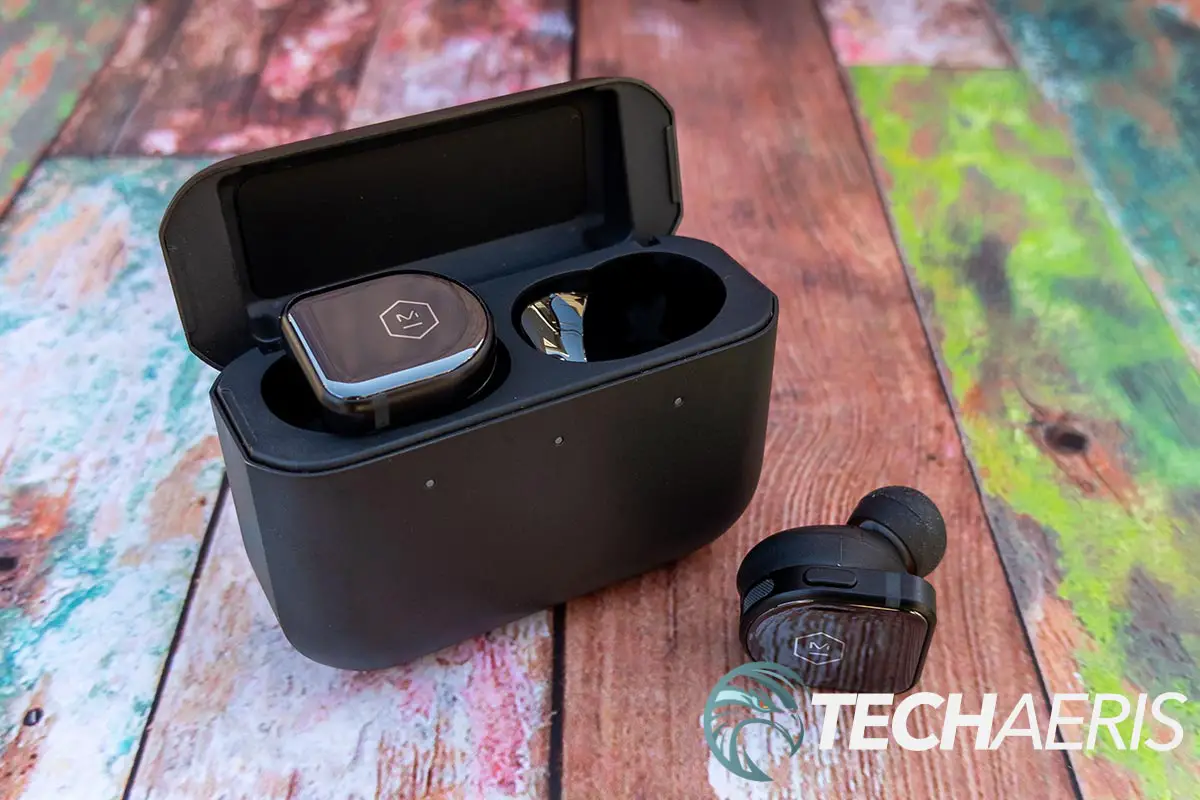 The Master & Dynamic MW08 true wireless earbuds with the included stainless steel charging case