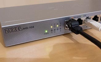 The Zyxel MG-108 8-Port 2.5GbE Unmanaged Switch powered on with cables connected