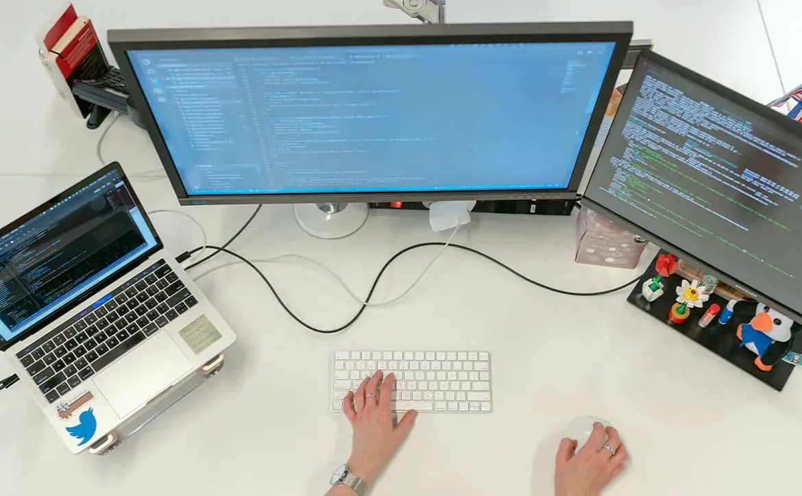 Automation workforce computer laptop monitors hands