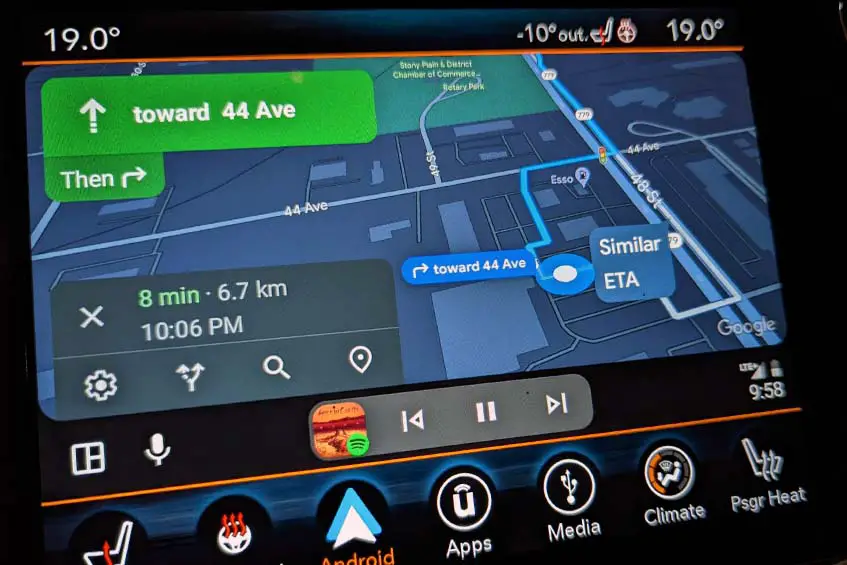 The Android Auto Coolwalk update showing Maps with Spotify app controls underneath