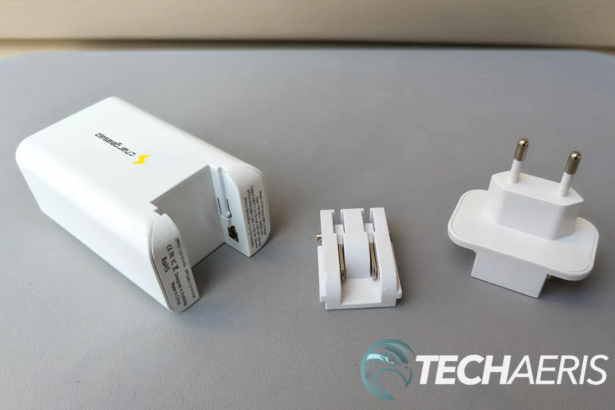The Chargeasap Zeus 270W USB-C GaN Wall Charger with US and EU plug attachments