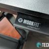 The levers on the side of the Ergotron WorkFit-TX standing desk converter