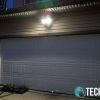 Swann Floodlight Security System installed above garage door at night
