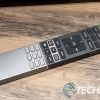 The main remote included with the BenQ V7050i 4K UST laser TV projector