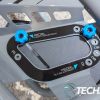 The guides on the outside bottom of the Playseat Trophy - Logitech G Edition for adjusting the tilt and angle of the pedal plate