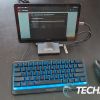The Plugable UDS-7IN1 USB-C Phone Stand Docking Station with keyboard and mouse attached to a 10" Android tablet