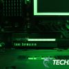 The Seagate Lightsaber Legends Special Edition FireCuda PCIe Gen4 NVMe SSD installed in a computer with green RGB LEDs lit