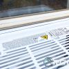 Outside view of the Hisense AW1021CW1W window air conditioner fully installed in a window