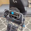 The Playseat Challenge X — Logitech G Edition sim racing seat folded up for storage