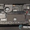 The internals inside the Lenovo Legion Go portable handheld gaming console with the NVMe SSD in the lower right
