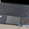 The keyboard and touchpad on the ASUS Zenbook 14 OLED laptop